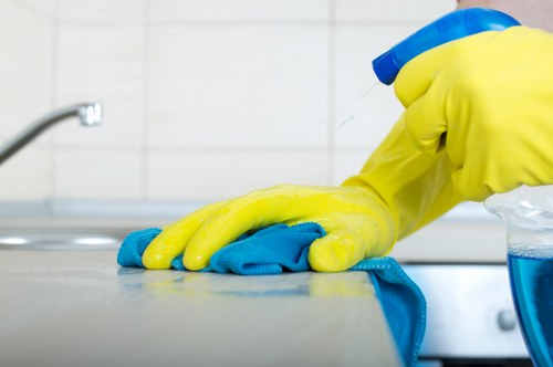 Kitchen surfaces being sanitized during move in cleaning
