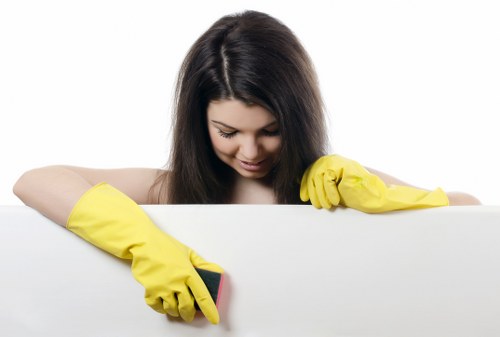 Commercial cleaning team sanitizing workplace surfaces