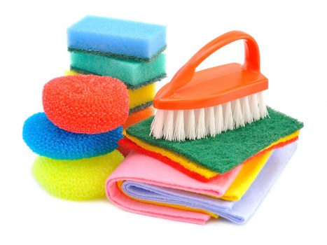 Eco-friendly domestic cleaning tools arranged on a counter